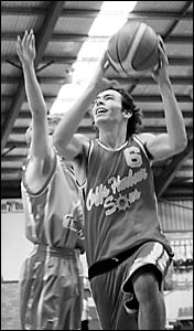 Suns player Jessie Browning brushes past the defence of a Raymond Terrace player during their easy win. Suns player Jessie Browning brushes past the defence of a Raymond Terrace player during their easy win.