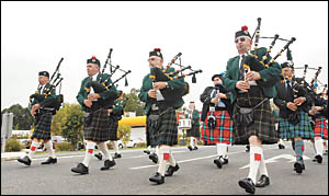 Pipers step out in unison to begin the street parade Pipers step out in unison to begin the street parade