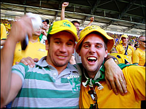 Adrian Miller, right, celebrates Australia?s win over Japan with Footy Show personality star Matthew Johns. Adrian Miller, right, celebrates Australia?s win over Japan with Footy Show personality star Matthew Johns.