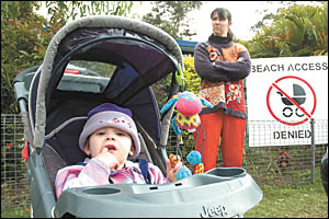 Arrawarra resident Kathryn Kenewell can?t wheel 16-month-old Helen to the beach in her pusher, not only because the access has Arrawarra resident Kathryn Kenewell can?t wheel 16-month-old Helen to the beach in her pusher, not only because the access has