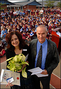DISPLAY OF PRIDE: Hanli and Stephen Jonker at their naturalisation ceremony in front of McAuley Catholic College students yeste DISPLAY OF PRIDE: Hanli and Stephen Jonker at their naturalisation ceremony in front of McAuley Catholic College students yeste