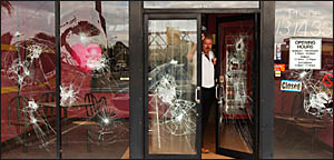 BUSINESS TARGETED: Eagle Boys South Grafton franchisee, Mark Hinds, rues the damage to his shop front by vandals overnight Thur BUSINESS TARGETED: Eagle Boys South Grafton franchisee, Mark Hinds, rues the damage to his shop front by vandals overnight Thur