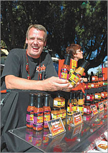 Marcel shows off his chilli products at the Sawtell Chilli Festival Marcel shows off his chilli products at the Sawtell Chilli Festival