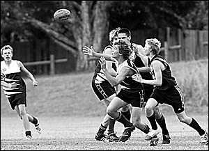 The North Coast?s Matt Whitlock, centre, follows the ball despite attention from two Far North Coast players in the under 16 re The North Coast?s Matt Whitlock, centre, follows the ball despite attention from two Far North Coast players in the under 16 re