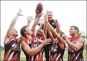 Russ Matthews surrounded by his sons hoping for a win. Russ Matthews surrounded by his sons hoping for a win.