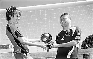 Eyes on the prize: Coffs United Lions player Ryan Turner (left) and Urunga Raiders rival Bradd Danzey both want to take home Eyes on the prize: Coffs United Lions player Ryan Turner (left) and Urunga Raiders rival Bradd Danzey both want to take home