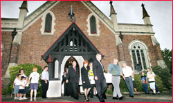 Mourners pay tribute as Mrs Fyfe is carried from the church after the funeral service. Mourners pay tribute as Mrs Fyfe is carried from the church after the funeral service.