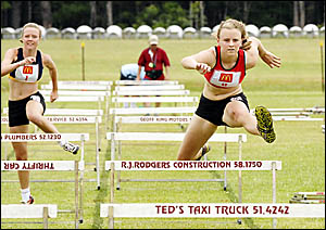 Brianna McCabe races away to win the 90m hurdles. Photo: TREVOR VEALE Brianna McCabe races away to win the 90m hurdles. Photo: TREVOR VEALE