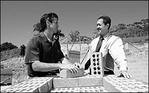 Builder Brian Hopwood talks to the Federal member for Cowper, Luke Hartsuyker, on the site of a display home he has under const Builder Brian Hopwood talks to the Federal member for Cowper, Luke Hartsuyker, on the site of a display home he has under const