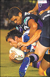 Former Bowraville junior and now Melbourne superstar Greg Inglis follows through with a crunching tackle. Photo: CHRIS Former Bowraville junior and now Melbourne superstar Greg Inglis follows through with a crunching tackle. Photo: CHRIS