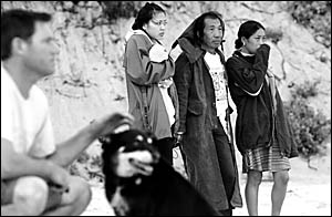 IN SHOCK: Wawan Prahara (centre) with the missing woman?s distraught sister and friend at the beach after her disappearance yes IN SHOCK: Wawan Prahara (centre) with the missing woman?s distraught sister and friend at the beach after her disappearance yes