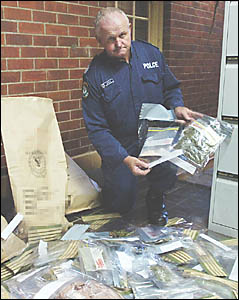 DRUGS HAUL: Sgt Cliff McPherson at the Lismore police station on Sunday with some of the drugs seized by police during the Mard DRUGS HAUL: Sgt Cliff McPherson at the Lismore police station on Sunday with some of the drugs seized by police during the Mard