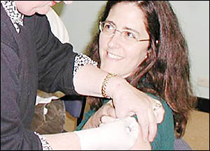 FLU AWAY: Dr Sue Page is given a flu vaccine in 2006. FLU AWAY: Dr Sue Page is given a flu vaccine in 2006.