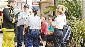 BETTER SAFE THAN SORRY: Emergency workers outside Lismore?s Conway Plaza with gym staff Suzanna Casson (centre left) and Joanne BETTER SAFE THAN SORRY: Emergency workers outside Lismore?s Conway Plaza with gym staff Suzanna Casson (centre left) and Joanne