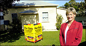 LJ Hooker Lennox Head sales consultant Helen Grant in front of the Uniting Church property being sold by expressions of interes LJ Hooker Lennox Head sales consultant Helen Grant in front of the Uniting Church property being sold by expressions of interes
