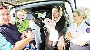 Proud dad Rob Anderson and son Kobi, 1, check out the back of the ambulance in which little sister Sharlie-Anne was born on Thu Proud dad Rob Anderson and son Kobi, 1, check out the back of the ambulance in which little sister Sharlie-Anne was born on Thu