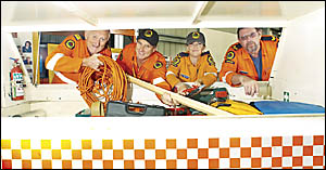 AT THE READY: SES workers (from left) Lindsay Matterson, Steve Donovan, Melinda Rosewarne and Stuart Ferguson, prepare for the AT THE READY: SES workers (from left) Lindsay Matterson, Steve Donovan, Melinda Rosewarne and Stuart Ferguson, prepare for the
