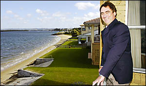 LOOKING GOOD: Real estate agent Keith Jones inspects the waterfront view at 2 Latta%Avenue, Ballina, which has a $2.1 million p LOOKING GOOD: Real estate agent Keith Jones inspects the waterfront view at 2 Latta%Avenue, Ballina, which has a $2.1 million p