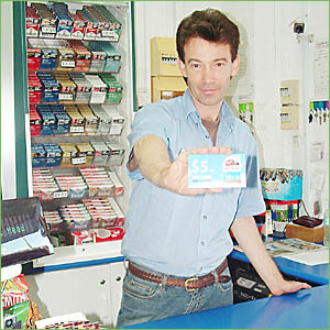 ON THE CARDS: Phil Whitby, of Lennox Head Caltex service station, with a mobile SIM card that is readily available over the cou ON THE CARDS: Phil Whitby, of Lennox Head Caltex service station, with a mobile SIM card that is readily available over the cou