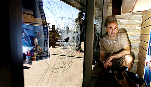 SHATTERED: Shane Wehner from Off the Wall surf shop had three holes smashed into the front windows of his shop in Ballina Centr SHATTERED: Shane Wehner from Off the Wall surf shop had three holes smashed into the front windows of his shop in Ballina Centr