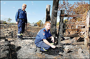 BURNT OUT: Coraki Fire brigade captain Bob Duncan and Beth McGrath in one of the areas ravaged by grass fires in the past week. BURNT OUT: Coraki Fire brigade captain Bob Duncan and Beth McGrath in one of the areas ravaged by grass fires in the past week.