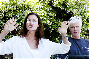 Linda Whitehurst, pictured at Byron Shire Hospital yesterday with her husband Glen, indicates how she fended off the great whit Linda Whitehurst, pictured at Byron Shire Hospital yesterday with her husband Glen, indicates how she fended off the great whit