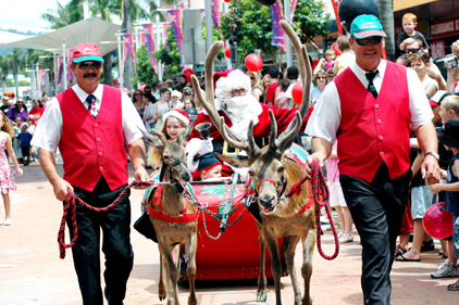 Yule love this time of year ... Santa makes his grand entrance to the Palms Centre shopping centre in Coffs Harbour. Yule love this time of year ... Santa makes his grand entrance to the Palms Centre shopping centre in Coffs Harbour.