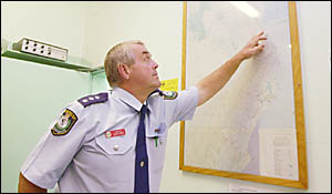 FRANTIC SEARCH: Inspector Owen King, of Byron Bay police, illustrating to the media the%area where the trawler is believed to h FRANTIC SEARCH: Inspector Owen King, of Byron Bay police, illustrating to the media the%area where the trawler is believed to h