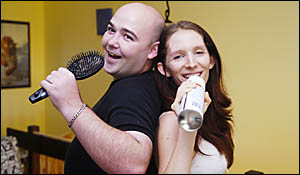 KARAOKE COUPLE: Karaoke final hopefuls are Goonellabah couple Jeff Morris and Naomi%Watson, pictured getting in some practice a KARAOKE COUPLE: Karaoke final hopefuls are Goonellabah couple Jeff Morris and Naomi%Watson, pictured getting in some practice a