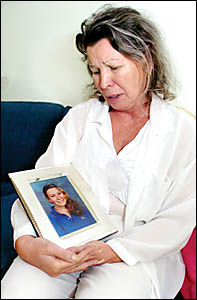 DEEP GRIEF: Josephine Conway cradles a photo of her daughter Melody. DEEP GRIEF: Josephine Conway cradles a photo of her daughter Melody.