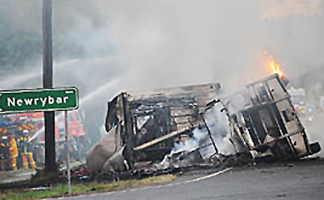 The burning B-double which closed the Pacific Highway late yesterday near Newrybar following an accident with two cars. The burning B-double which closed the Pacific Highway late yesterday near Newrybar following an accident with two cars.