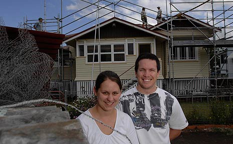 Jillian and Ian Coutts stand outside their Lismore home that's still being fixed after last year's hailstorm. Jillian and Ian Coutts stand outside their Lismore home that's still being fixed after last year's hailstorm.