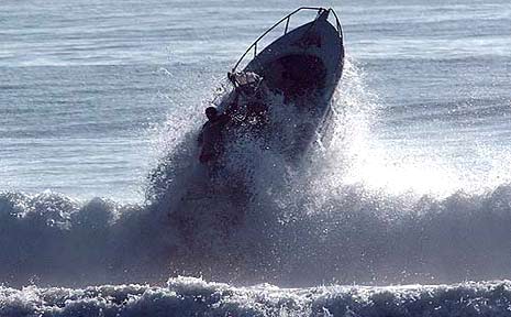 A boat nearly comes to grief as it attempts to cross a bar. A boat nearly comes to grief as it attempts to cross a bar.