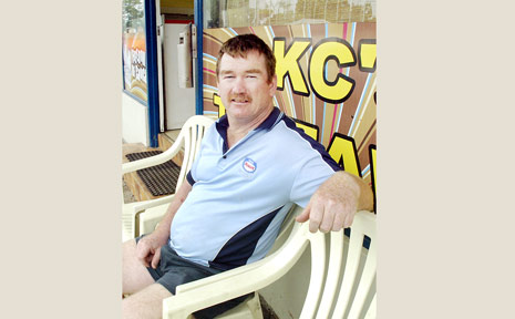 BUM NOTE: Takeaway owner Leon Reid sits on plastic chairs provided for customers after a table and chairs were stolen. BUM NOTE: Takeaway owner Leon Reid sits on plastic chairs provided for customers after a table and chairs were stolen.