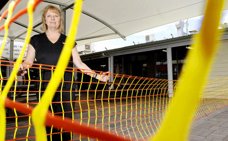 Spar Supermarket manager Vicki Everson believes the new security gates at the Suffolk Park Shopping Centre will discourage vandalism within the complex. Spar Supermarket manager Vicki Everson believes the new security gates at the Suffolk Park Shopping Centre will discourage vandalism within the complex.