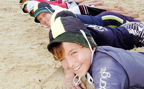 LINING UP: Jed Simpson, 12, gets a head start in surf skills from Lennox Head Public school fellow students with lifesavers yesterday. LINING UP: Jed Simpson, 12, gets a head start in surf skills from Lennox Head Public school fellow students with lifesavers yesterday.