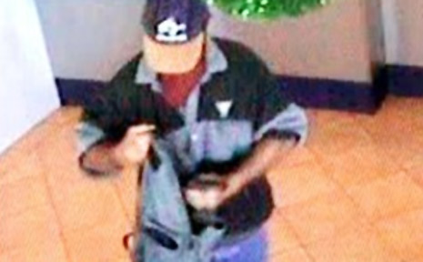 The robber leaving the Southern Cross Credit Union at Lennox Head on Tuesday about 3.30pm. The robber leaving the Southern Cross Credit Union at Lennox Head on Tuesday about 3.30pm.