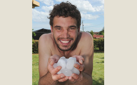 Eli Morris, of Glen Innes, holds some of the hailstones which fell on Goonellabah during yesterday’s storm. Eli Morris, of Glen Innes, holds some of the hailstones which fell on Goonellabah during yesterday’s storm.