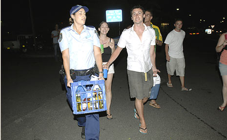 Police confiscating alcohol from people illegally drinking on the streets of Byron Bay last year. Police confiscating alcohol from people illegally drinking on the streets of Byron Bay last year.