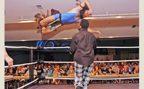 International Wrestling Australia came to Ballina RSL last Friday. Here, Apache Warrior jumps from the top rope onto Reggie Watson. International Wrestling Australia came to Ballina RSL last Friday. Here, Apache Warrior jumps from the top rope onto Reggie Watson.
