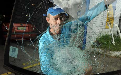 Ken McLean with his broken windscreen. Ken McLean with his broken windscreen.