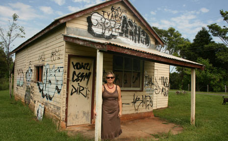 Kylie Johnston of Tyagarah stands in front of the Tyagarah Meat Pool which has been extensively damaged by graffiti. Kylie Johnston of Tyagarah stands in front of the Tyagarah Meat Pool which has been extensively damaged by graffiti.