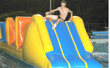 17-year-old Ashley Lumsden is a regular at Mullumbimby pool Friday nights, and has the fastest time on the inflatable in one of eight categories. 17-year-old Ashley Lumsden is a regular at Mullumbimby pool Friday nights, and has the fastest time on the inflatable in one of eight categories.