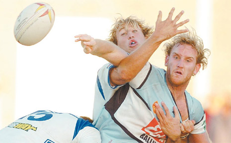 Gang tackle: Ghosts backrow pair Adam Elliott (left) and Josh Donohoe jar the ball loose with a punishing hit. Gang tackle: Ghosts backrow pair Adam Elliott (left) and Josh Donohoe jar the ball loose with a punishing hit.