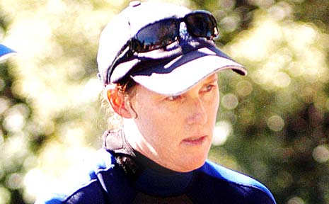 SEA WORLD’S Alana Keane rescues the baby dolphin. SEA WORLD’S Alana Keane rescues the baby dolphin.