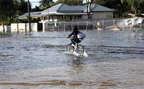 A cyclist pedals through floodwaters in Ewingsdale Road near Kendall Street last week. A cyclist pedals through floodwaters in Ewingsdale Road near Kendall Street last week.