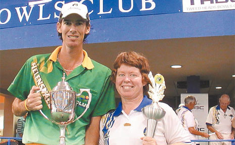 Gold Coaster Nathan Rice and Tweed Heads bowler Lyn Cuthbertson display their trophies after taking out their respective finals in the Queensland State Singles Champsionships on Monday. Gold Coaster Nathan Rice and Tweed Heads bowler Lyn Cuthbertson display their trophies after taking out their respective finals in the Queensland State Singles Champsionships on Monday.
