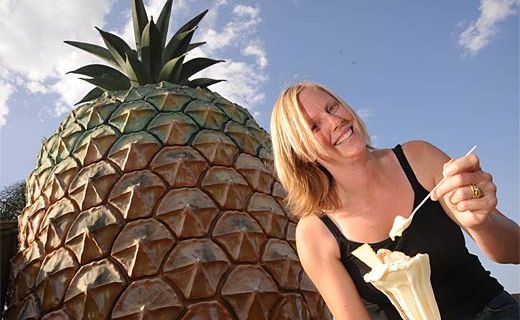 Michelle Jude enjoys a Big Pineapple sundae in front of the icon. Michelle Jude enjoys a Big Pineapple sundae in front of the icon.