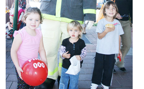 ‘Bernie Cinders’ from the NSW Fire Brigade was popular with the children at the Old and Gold Festival on Saturday. He is joined by (from left) Danielle Mathie, 3, of Bangalow, and Sara, 2, and David Irace, 4, of Brunswick Heads. ‘Bernie Cinders’ from the NSW Fire Brigade was popular with the children at the Old and Gold Festival on Saturday. He is joined by (from left) Danielle Mathie, 3, of Bangalow, and Sara, 2, and David Irace, 4, of Brunswick Heads.