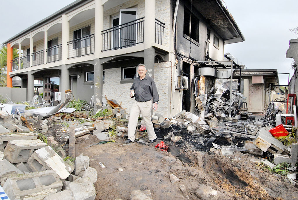 Keith Ryan surveys the damage after a truck ploughed into his motel on Nebo Road in 2009, sparking the ring road push. Keith Ryan surveys the damage after a truck ploughed into his motel on Nebo Road in 2009, sparking the ring road push.